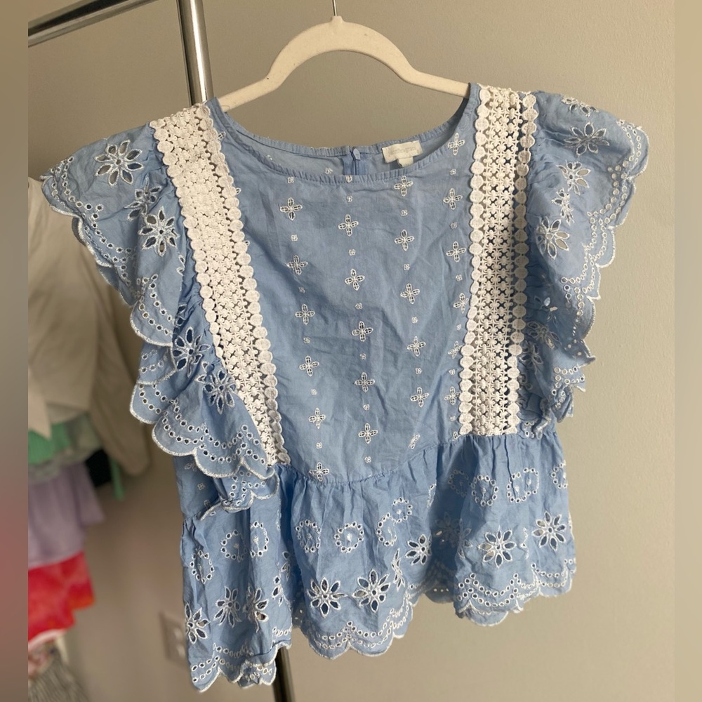 Women’s Medium eyelet ruffle blouse with crotchet detail.